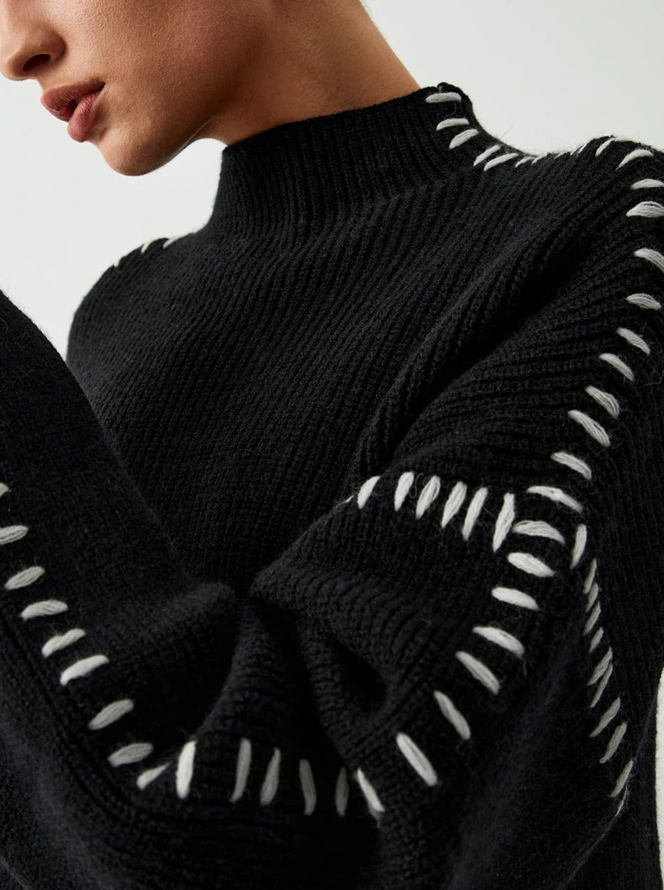 Women's crew neck knit sweater with contrast stitch detailing and long sleeves