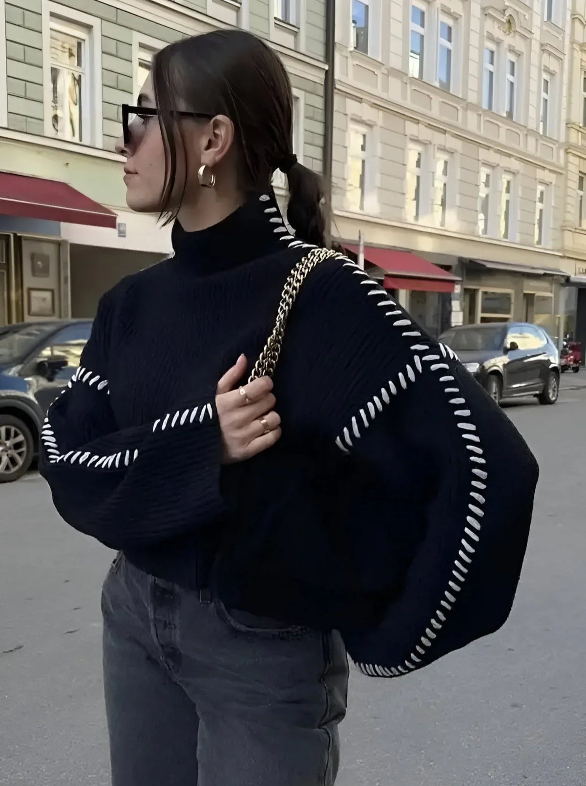 Women's crew neck knit sweater with contrast stitch detailing and long sleeves