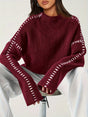 Women's crew neck knit sweater with contrast stitch detailing and long sleeves