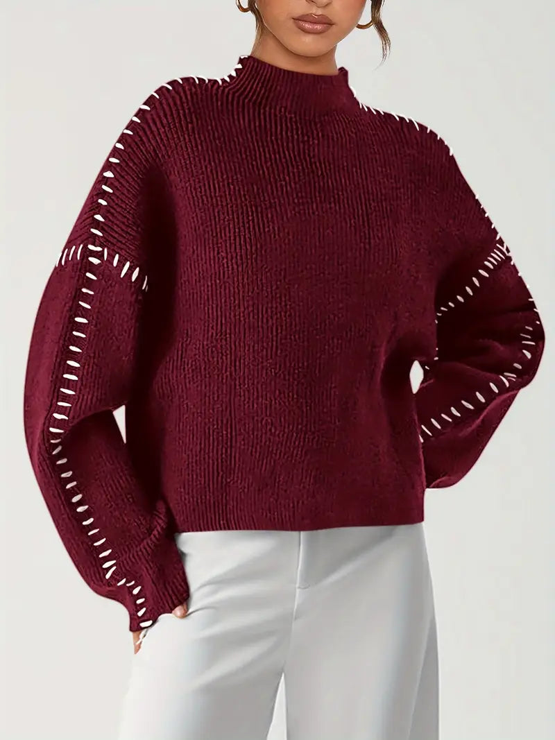 Women's crew neck knit sweater with contrasting stitch detailing on the sleeves