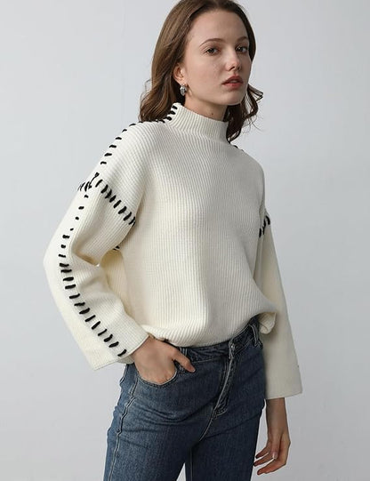 Women's crew neck knit sweater with contrast stitch detailing and long sleeves