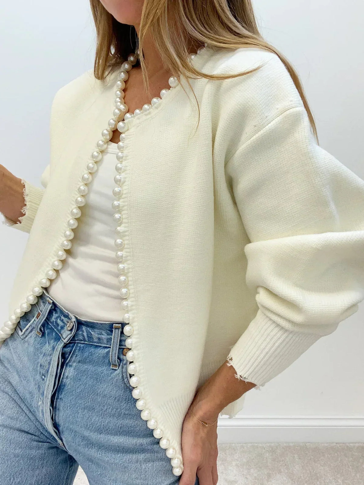 Women's open-front cardigan with pearl trim and long sleeves