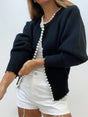 Women's open-front cardigan with pearl trim and long sleeves