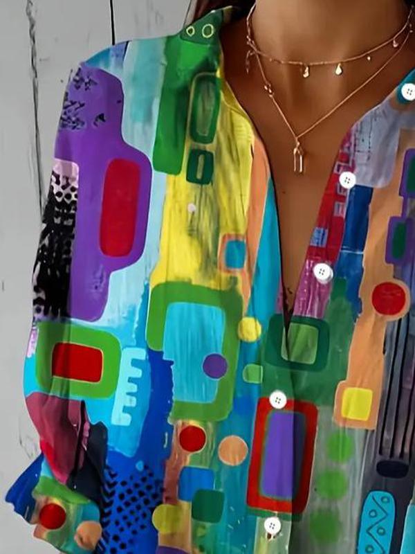 Woman wearing a multicolor abstract print blouse with collar and long sleeves