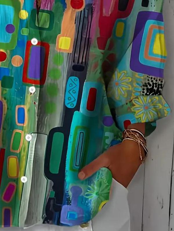 Woman wearing a multicolor abstract print blouse with collar and long sleeves
