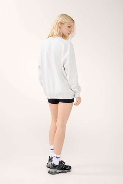 Women's white marle crew-neck sweater with chest graphic