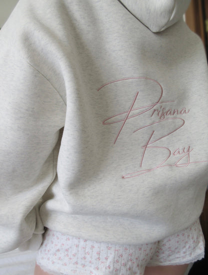 Light gray oversized hoodie with pink bow embroidery and floral hood lining