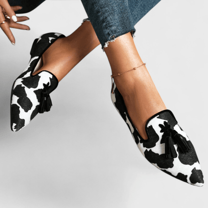 Pointed animal print loafers with tassel trim
