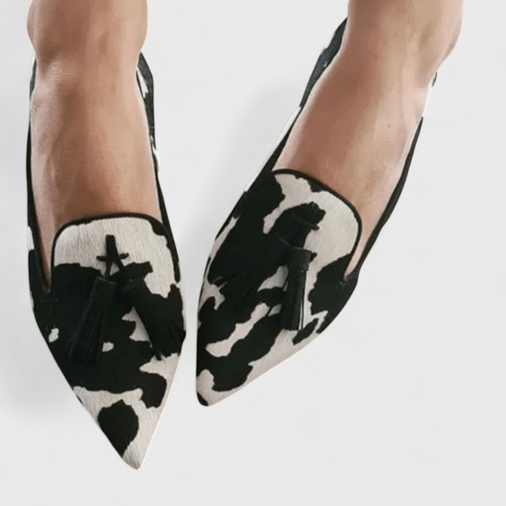 Pointed animal print loafers with tassel trim