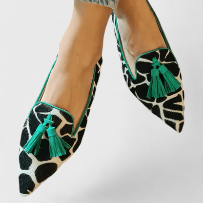 Pointed animal print loafers with tassel trim