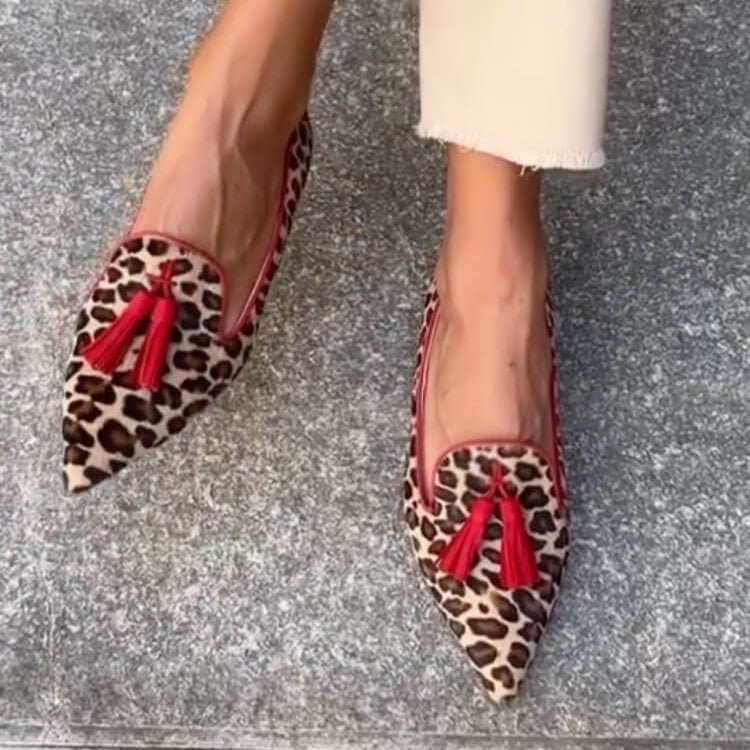 Pointed animal print loafers with tassel trim