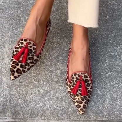 Pointed animal print loafers with tassel trim
