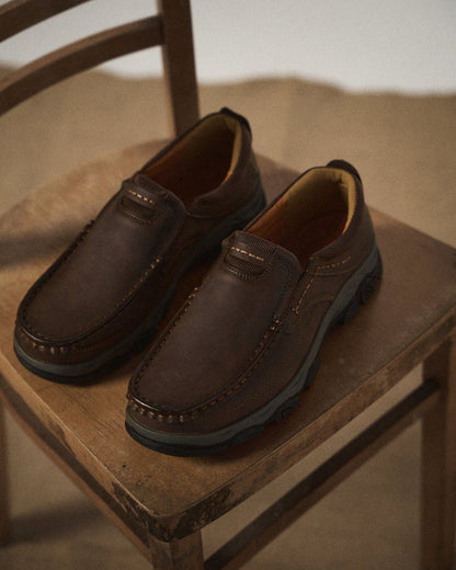 Men's casual moc toe loafers with stitched detailing and textured soles