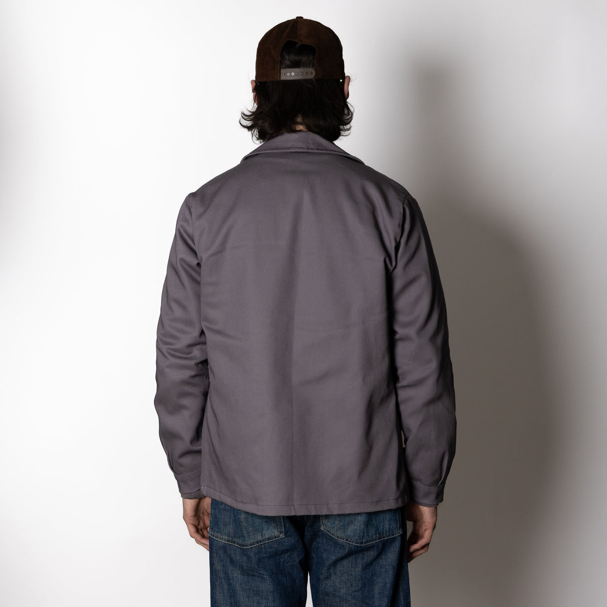 Men's gray utility jacket with pointed collar, long sleeves and four patch pockets