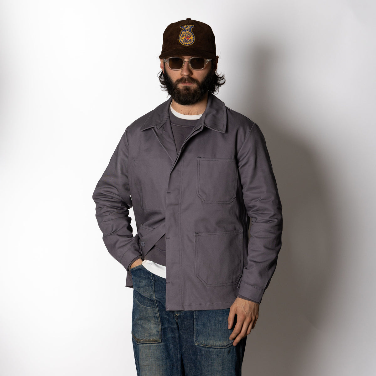 Men's gray utility jacket with pointed collar, long sleeves and four patch pockets
