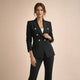 Women's black double breasted blazer suit set with tailored trousers, shown from front and side