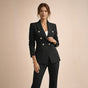 Women's black double breasted blazer suit set with tailored trousers, shown from front and side