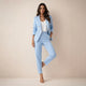 Women's black double breasted blazer suit set with tailored trousers, shown from front and side