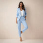 Women's black double breasted blazer suit set with tailored trousers, shown from front and side