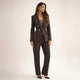 Women's black double breasted blazer suit set with tailored trousers, shown from front and side