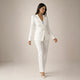 Women's black double breasted blazer suit set with tailored trousers, shown from front and side