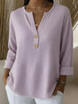 Women's textured waffle henley top with split neckline, buttons and long sleeves