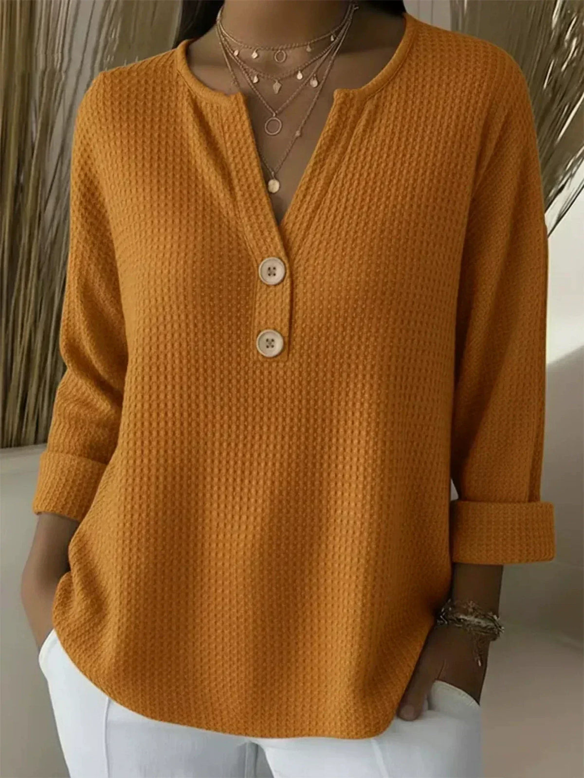 Women's textured waffle henley top with split neckline, buttons and long sleeves