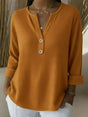 Women's textured waffle henley top with split neckline, buttons and long sleeves