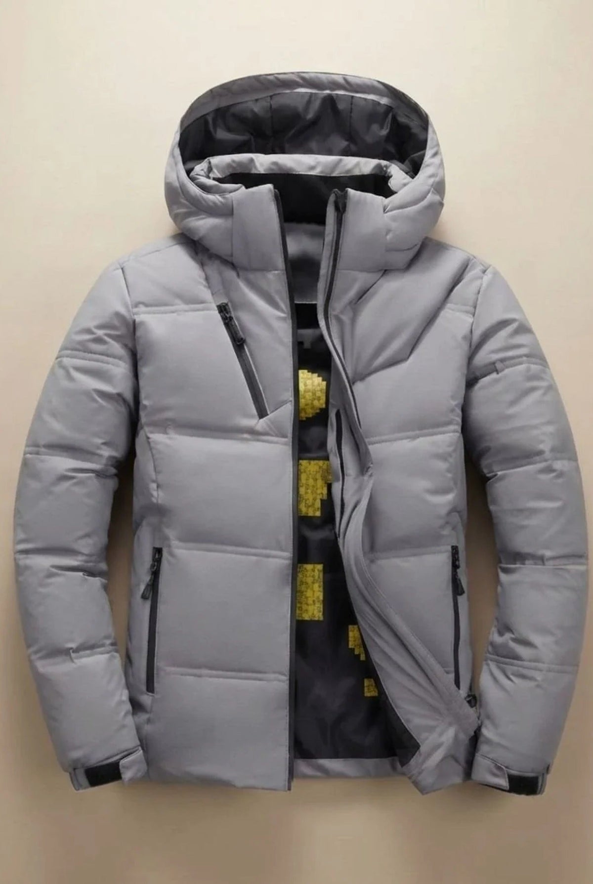 Men's hooded padded jacket with quilted panels and zip pockets