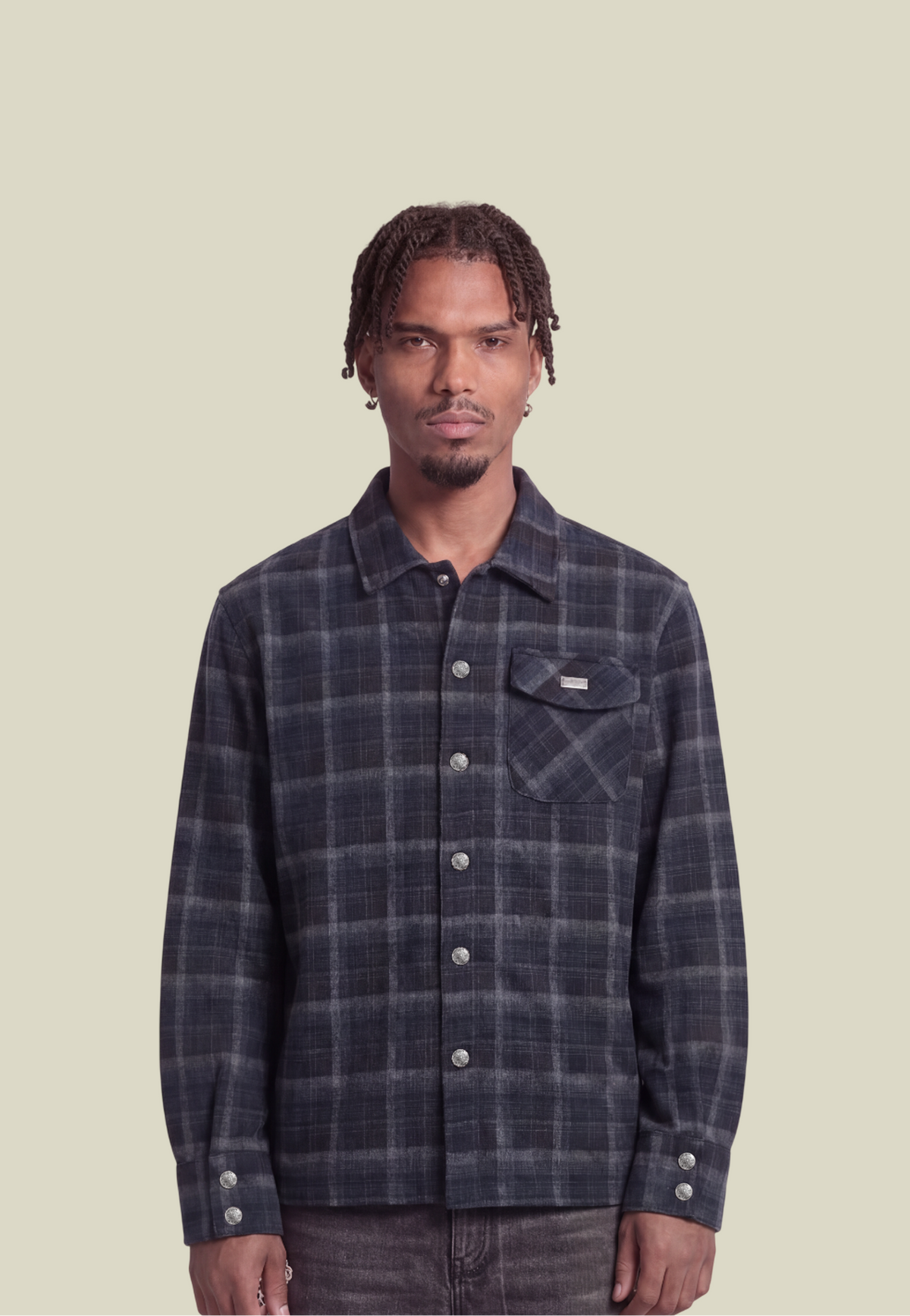 Men's navy plaid long-sleeve shirt with button front, chest pocket and decorative back motif