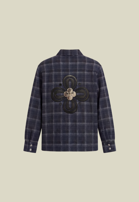 Men's navy plaid long-sleeve shirt with button front, chest pocket and decorative back motif