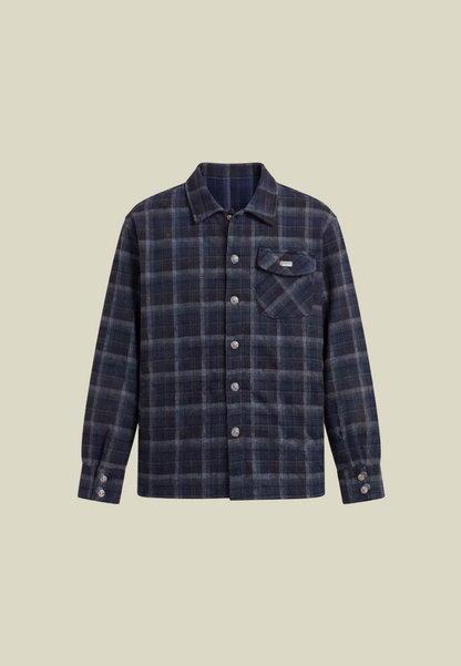 Men's navy plaid long-sleeve shirt with button front, chest pocket and decorative back motif