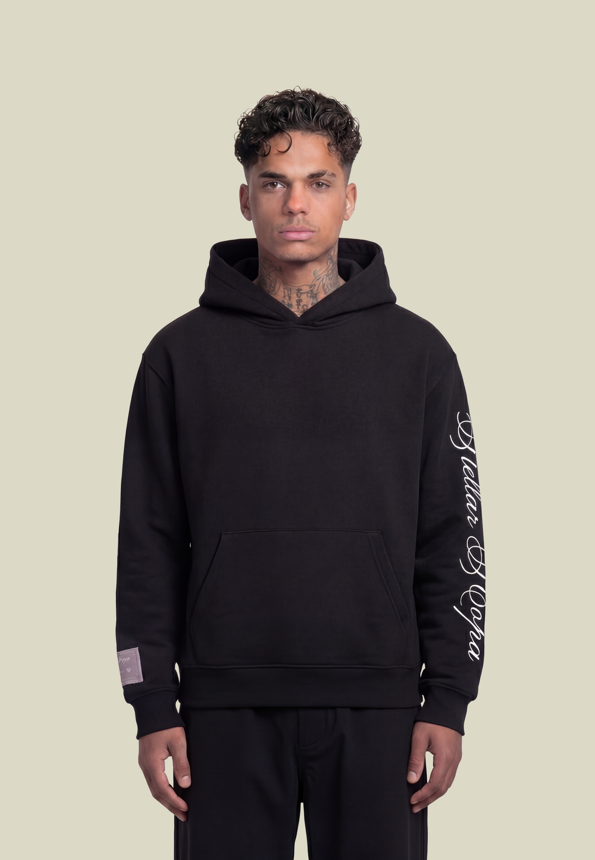 Black pullover hoodie with white sleeve graphic and front pouch pocket