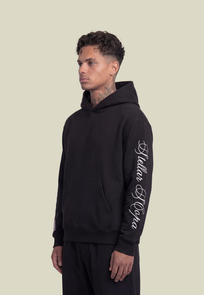 Black pullover hoodie with white sleeve graphic and front pouch pocket