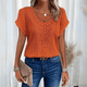 Woman wearing a relaxed waffle-knit top with an open crochet panel down the front and rolled cap sleeves