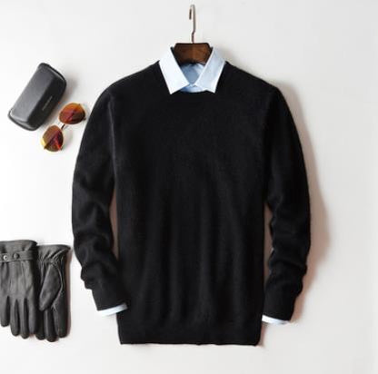 Men's plain knit crew neck sweater layered over a collared shirt