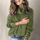 Women's ribbed turtleneck sweater with long sleeves and button cuffs