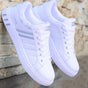 Men's low-top colorblock lace-up sneakers with contrast stripes and flat soles