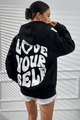 Women's hooded pullover with bold graphic lettering on the back