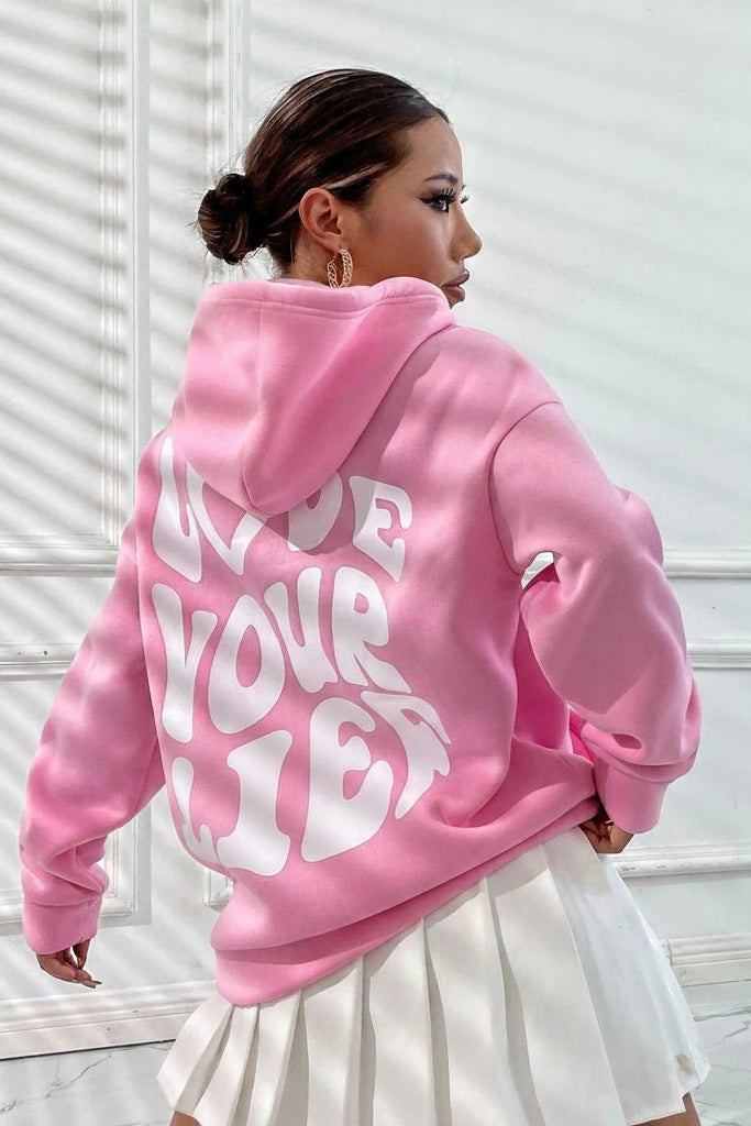 Women's hooded pullover with bold graphic lettering on the back