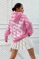 Women's hooded pullover with bold graphic lettering on the back