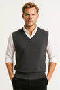 Men's sleeveless V-neck sweater vest with ribbed trims layered over a white shirt