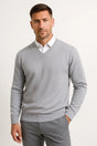 Men's plain V-neck sweater layered over a collared shirt