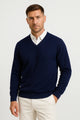 Men's plain V-neck sweater layered over a collared shirt