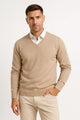 Men's plain V-neck sweater layered over a collared shirt
