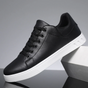 Men's low-top lace-up sneaker with stitched panels and white flat sole