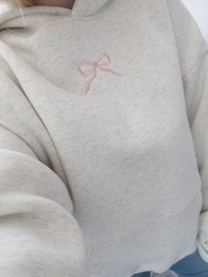 Light gray oversized hoodie with pink bow embroidery and floral hood lining