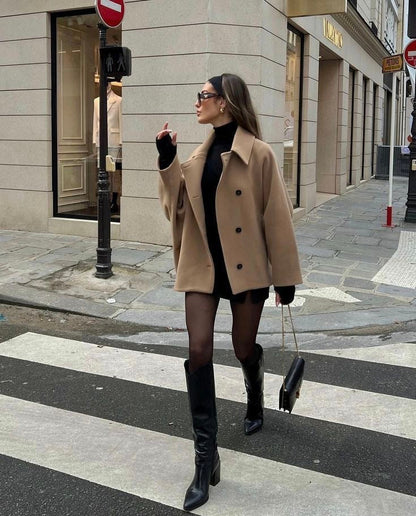 Women's oversized coat with point collar, button front and two welt pockets