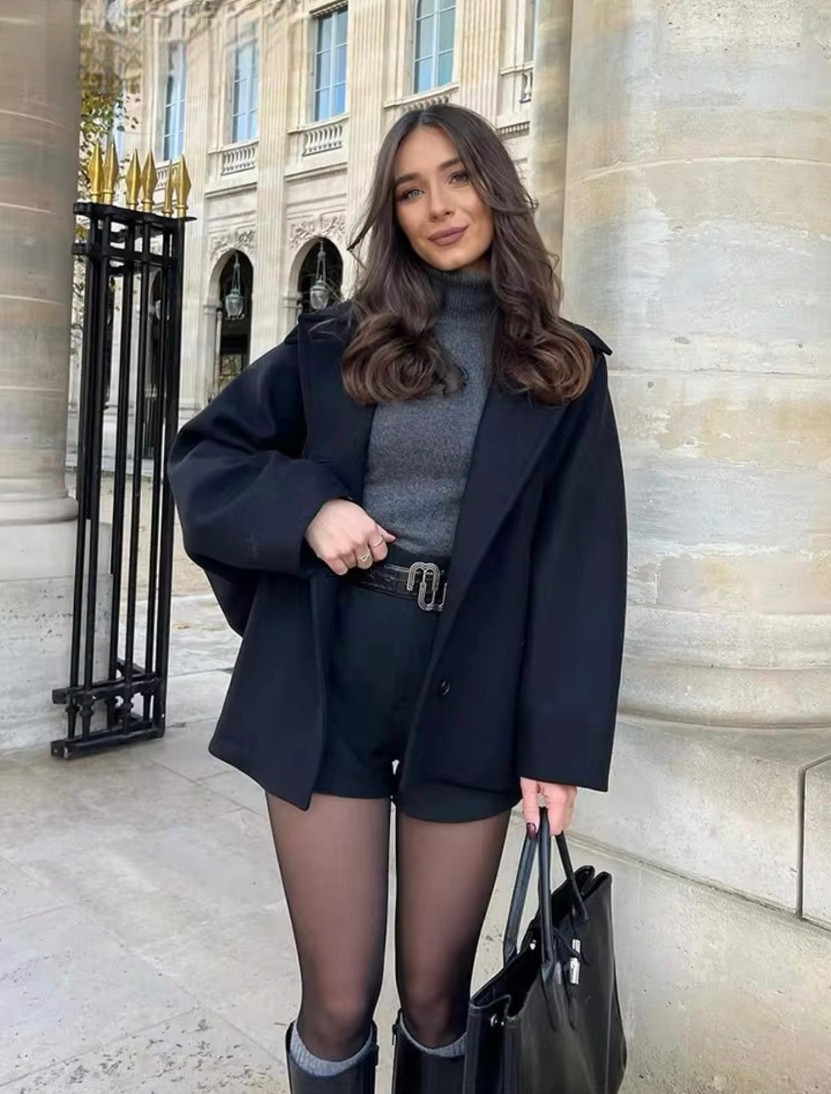 Women's oversized coat with point collar, button front and two welt pockets