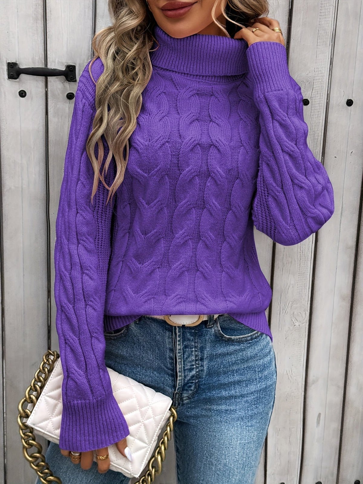 Women's cable knit turtleneck sweater with long sleeves and ribbed trims